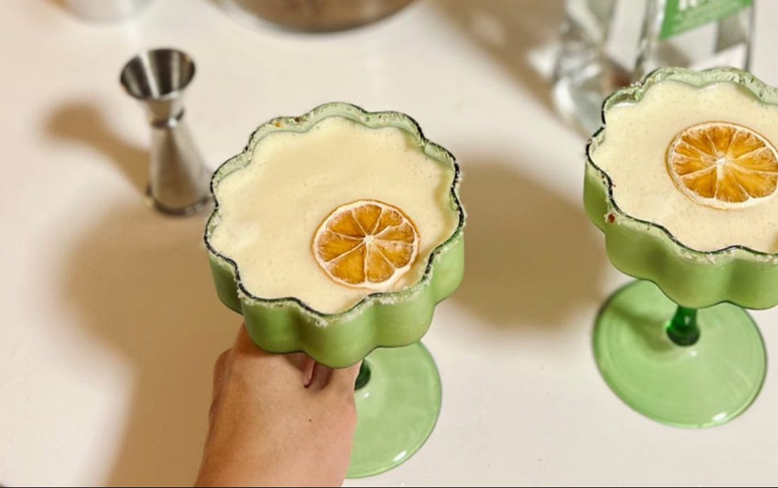 Pina Colada with a pineapple coconut sugar rim and dried edible flowers