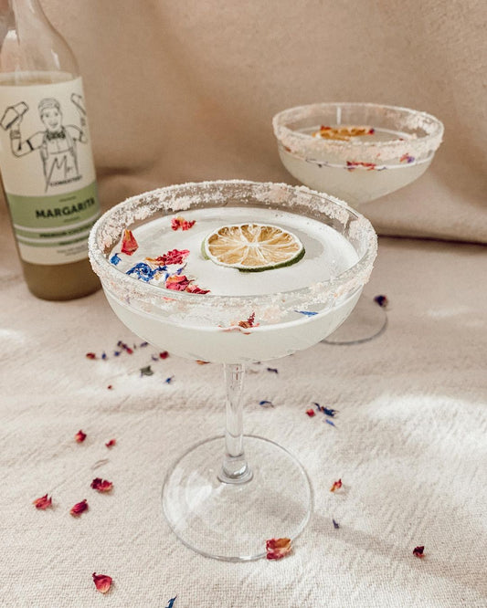 Margarita with a salted rim and a dried citrus garnish